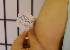 A temporary tattoo transfer positioned on an upper arm.